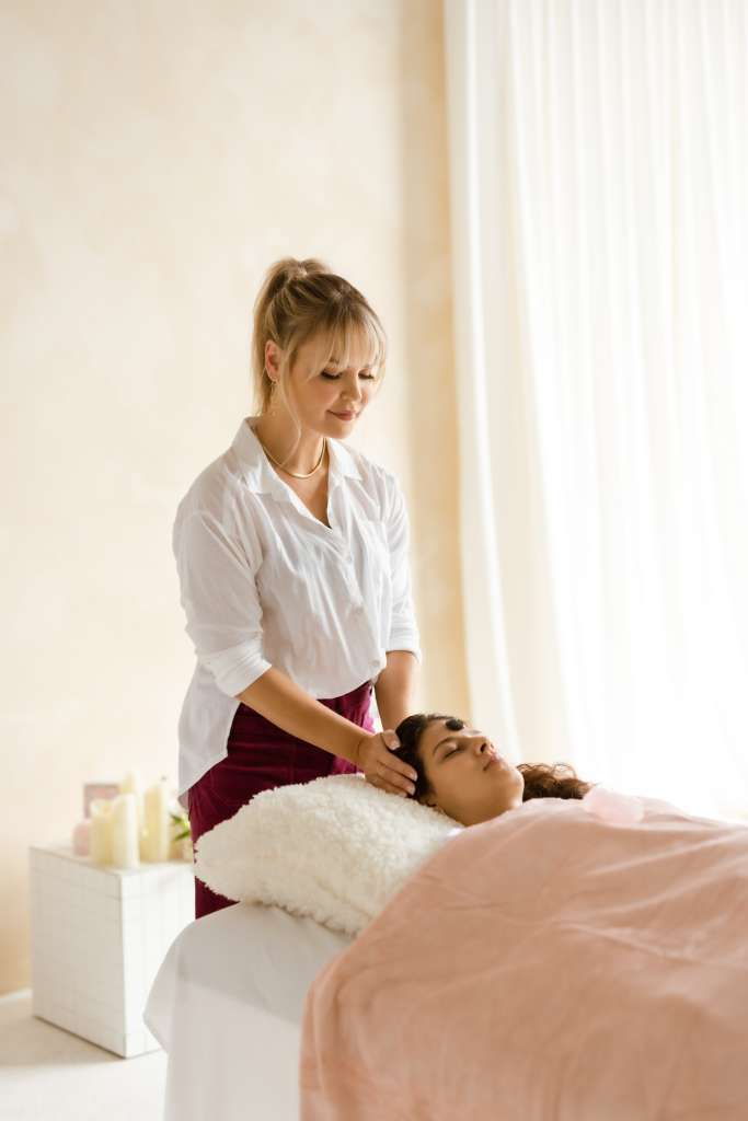 Patient receiving reiki treatment from the Toronto Energy with Julie office